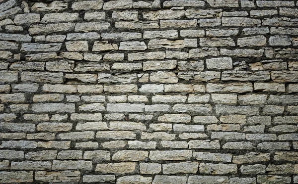 Vieux fond de mur en pierre grise — Photo