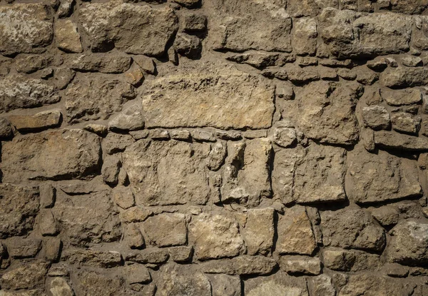 Vecchio modello di muro di pietre marroni — Foto Stock