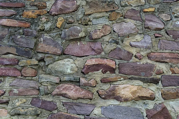 Ruwe bruin stenen muur achtergrond — Stockfoto