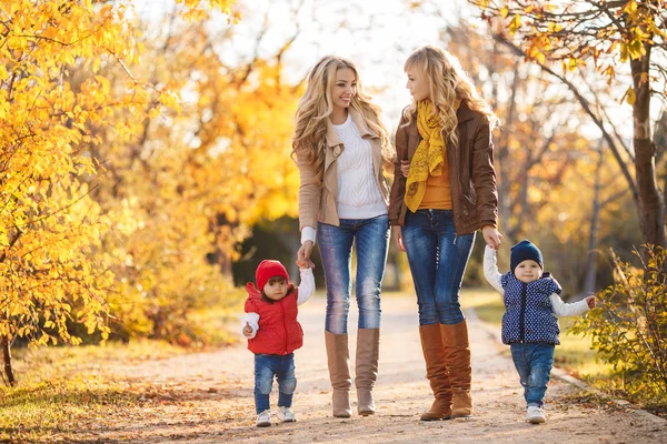 Mothers and children in autumn Park