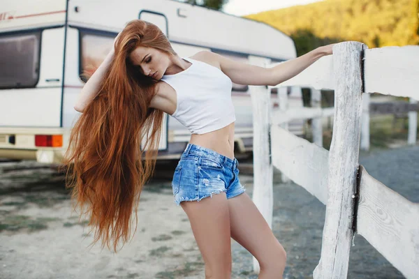 Portrait of sexy redheaded woman on a country ranch — Stock Photo, Image