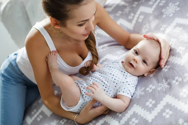 Young Mother Lying Bed Her Newborn Baby Boy Playing Together — Stock Photo, Image