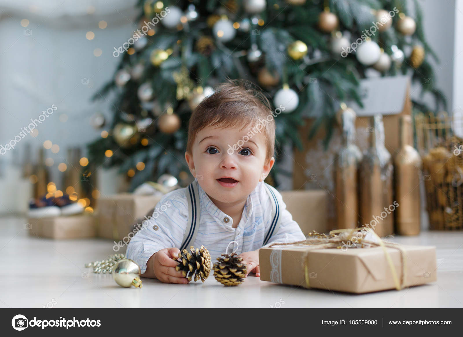 Little Boy Huge Brown Eyes Blond Short Hair Holding Toy Stock