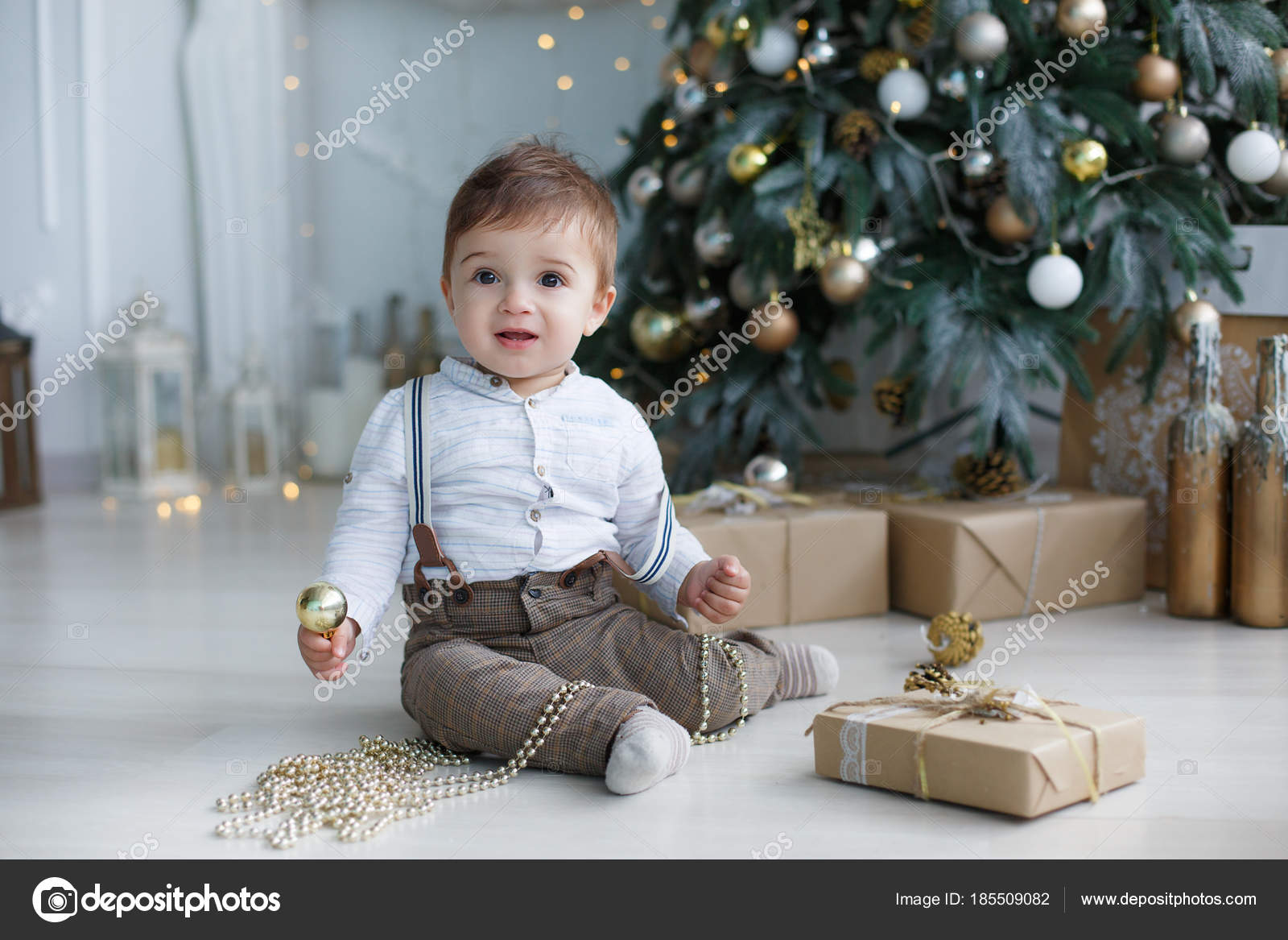 Little Boy Huge Brown Eyes Blond Short Hair Holding Toy Stock