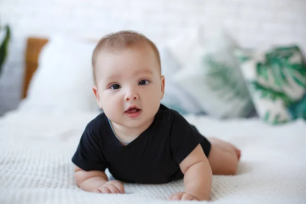 Adorable Baby Boy White Sunny Bedroom Plays Alone Lying Bed — Stock Photo, Image