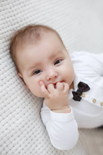 Adorable Baby Boy White Sunny Bedroom Plays Alone Lying Bed — Stock Photo, Image