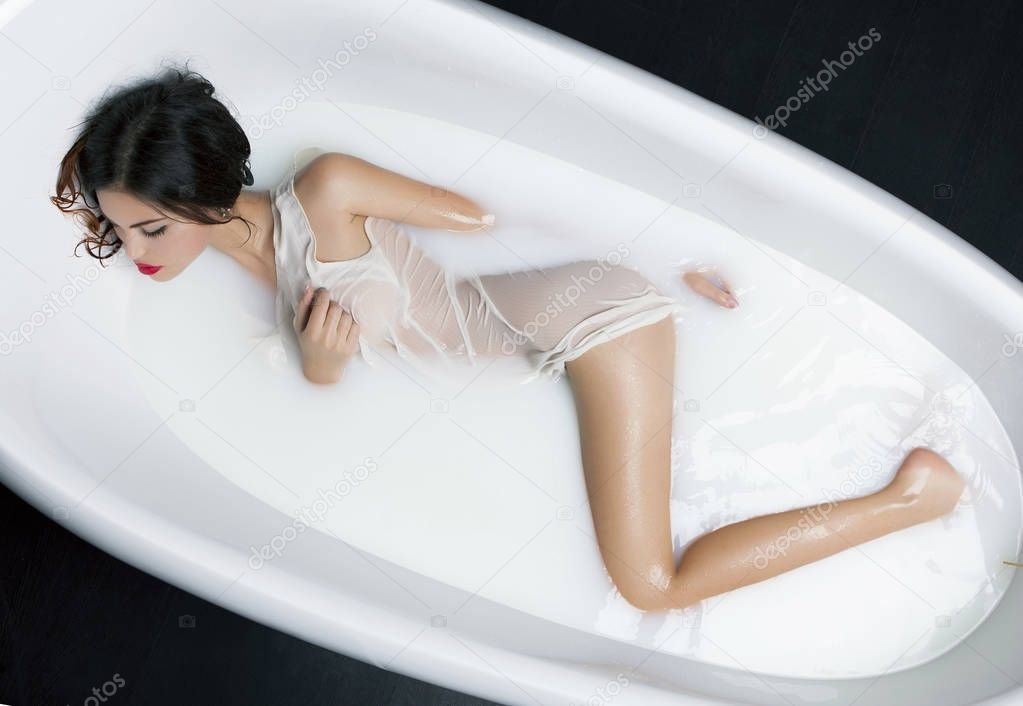 Milk Bath Spa and Sexy Woman in it.