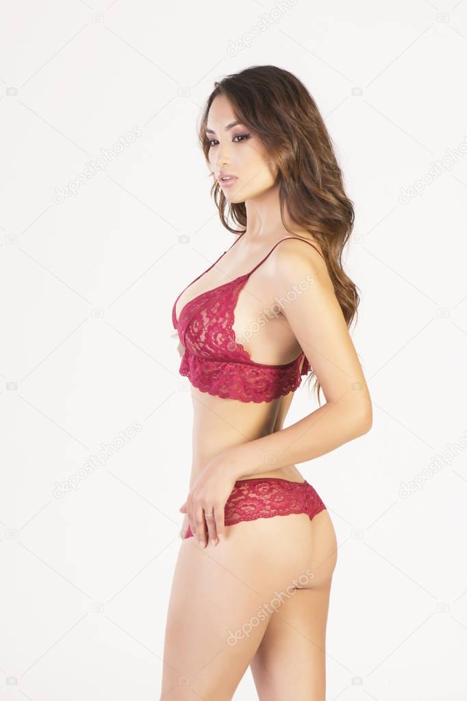 Sexy asian model posing in red lingerie