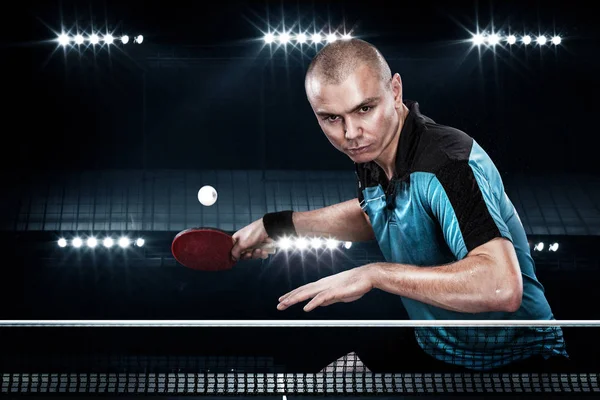 Portrait of sports man, male, athlete playing table tennis isolated on black background — Stock Photo, Image