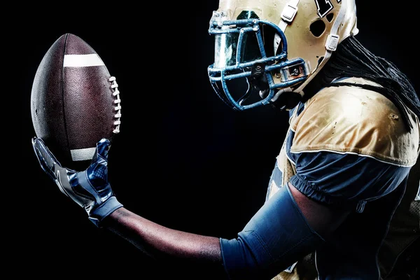 American football sportsman player isolated on black background — Stock Photo, Image