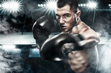 Sporcu muay Taylandlı boksör boks kafes dövüş. Arka plan ile ışık ve duman. Uzay kopyalayın. Spor kavramı.