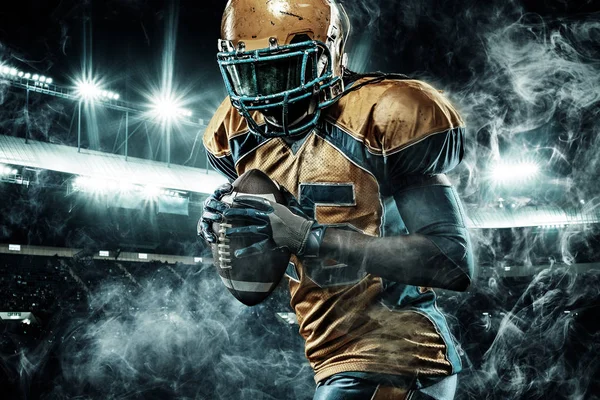 American football sportsman player on stadium running in action — Stock Photo, Image