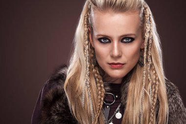 Portrait of viking woman in a traditional warrior clothes. clipart