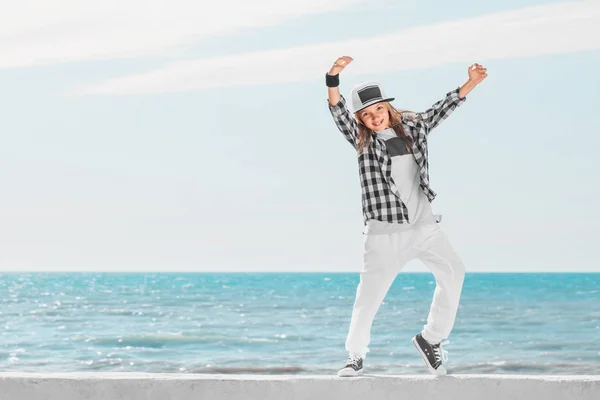 Fashion child dancing over sky background. — Stock Photo, Image