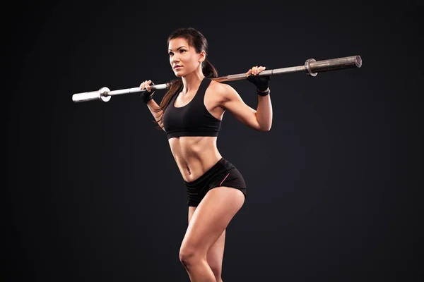 Desportivo anf ajuste bela mulher exercitando treinamento de treino com barra. Motivação física . — Fotografia de Stock