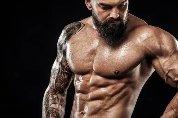 Closeup portrait of fit man with tattoo. Sport and fitness concept isolated on black background. — Stock Photo, Image