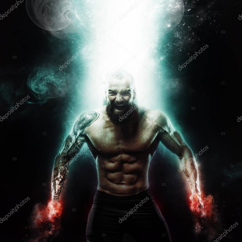 Sport and motivation wallpaper on dark background. Power athletic guy bodybuilder. Fire and energy