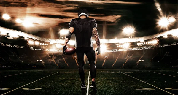 American football sportsman player on stadium. Sports banner and wallpaper with copyspace. — Stock Photo, Image