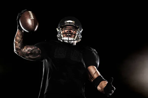 American football sportsman player isolated on black background — Stock Photo, Image