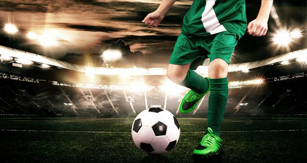 Kid - soccer player. Boy forward in football sportswear on stadium with ball. Sport concept. — Stock Photo, Image