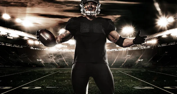 American football sportsman player on stadium. Sports banner and wallpaper with copyspace. — Stock Photo, Image