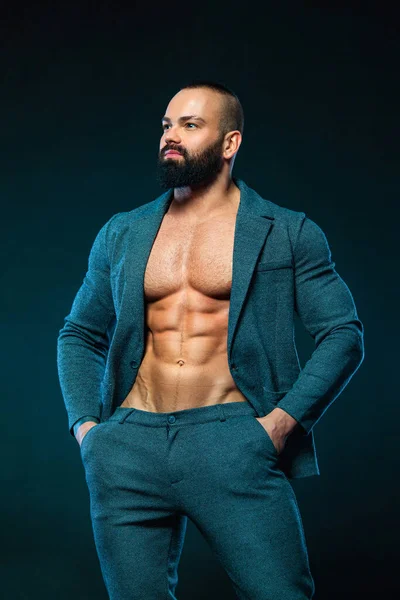 Portrait of handsome stylish man bodybuilder with naked torso in elegant suit — Stock Photo, Image