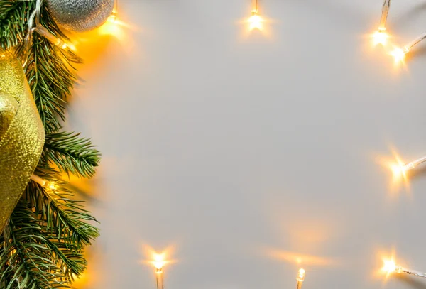 Christmas lights on gray table — Stock Photo, Image