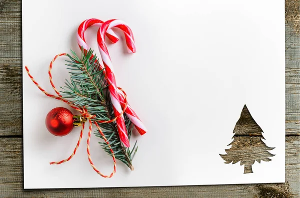 Cut paper in fir-tree shape on table — Stock Photo, Image