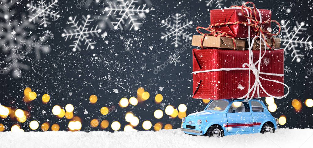 Retro toy car with christmas gifts