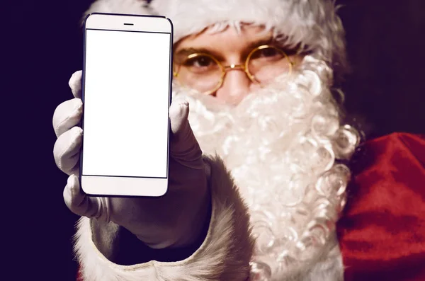 Santa Claus sosteniendo smartphone — Foto de Stock