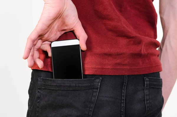 Mobile phone in a pocket — Stock Photo, Image