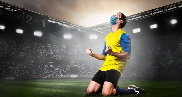 Soccer or football player in mask — Stock Photo, Image