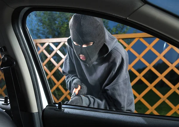 Man stealing car Stock Picture