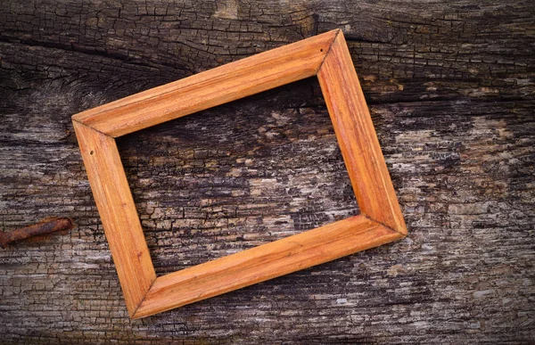 Houten frame op houten tafel achtergrond. — Stockfoto