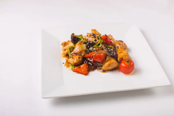 Teriyaki chicken with cherry tomatoes on a white background — Stock Photo, Image