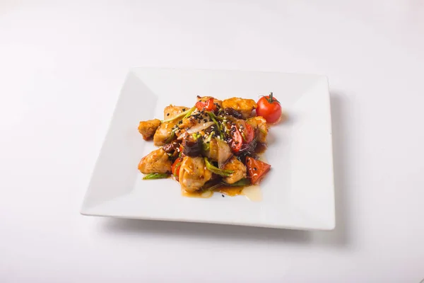 Teriyaki chicken with cherry tomatoes on a white background — Stock Photo, Image