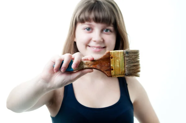 Young nice girl with brush on white background — Stock Photo, Image