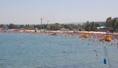ANAPA, RUSSIA - AUGUST 5, 2017: View of the Bay and the sandy beach in summer clipart