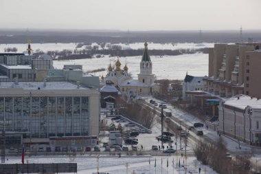 Yakutsk, Russia- March 14, 2019: Urban landscape.Top view of the winter city. clipart