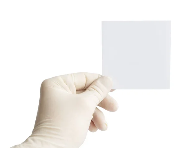 Gloved hand holding a piece of paper — Stock Photo, Image