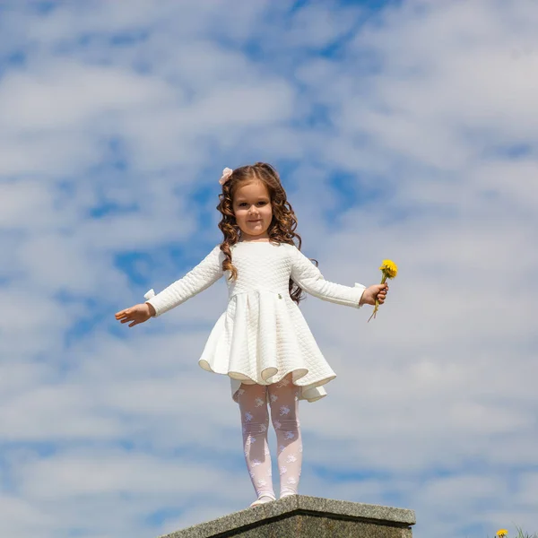 Little girl in the clouds — Stock Photo, Image