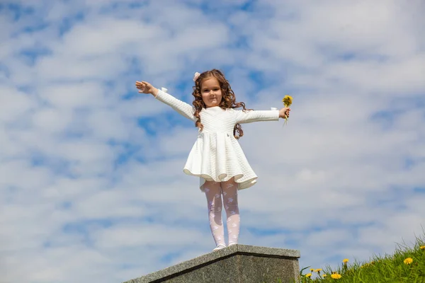 Little girl in the clouds — Stock Photo, Image