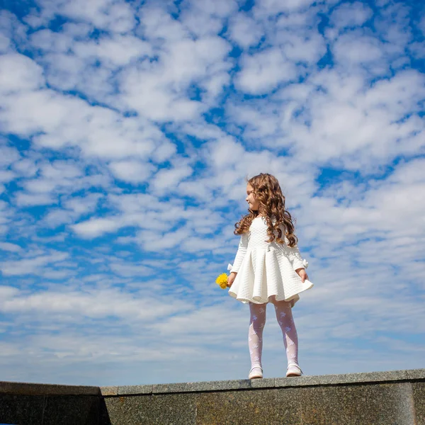 Little girl in the clouds — Stock Photo, Image