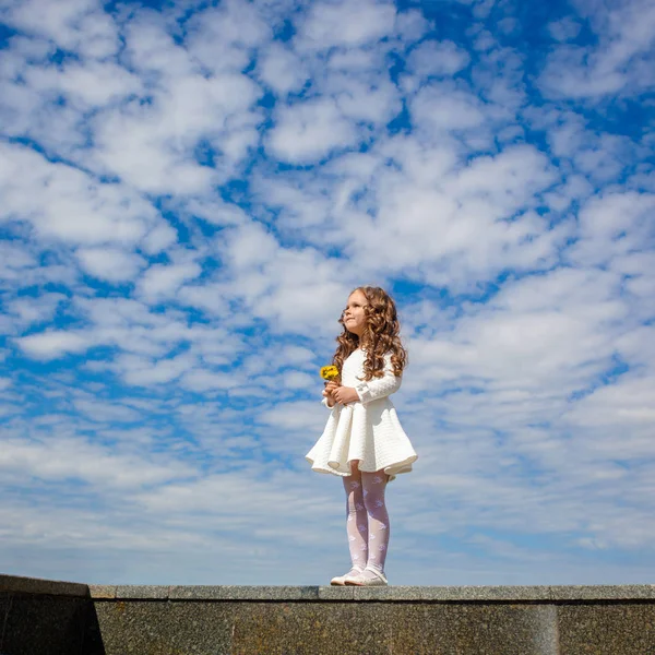 Little girl in the clouds — Stock Photo, Image