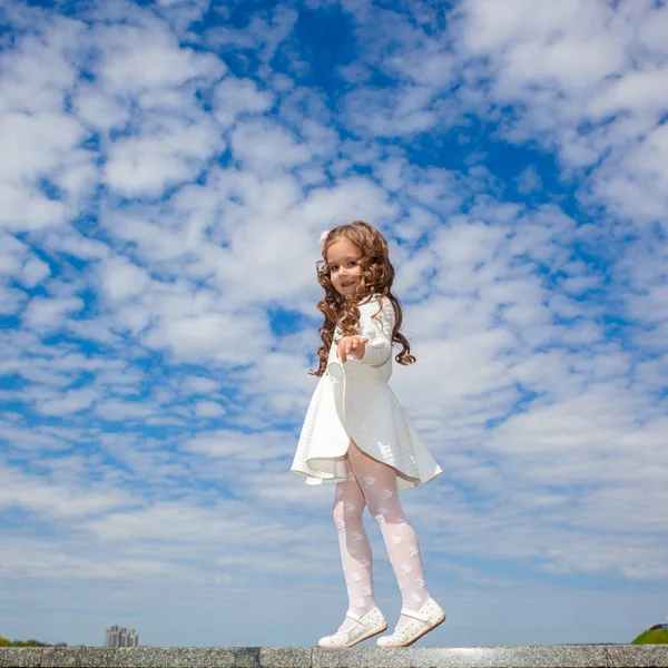 depositphotos_140186986-stock-photo-little-girl-in-the-clouds.jpg
