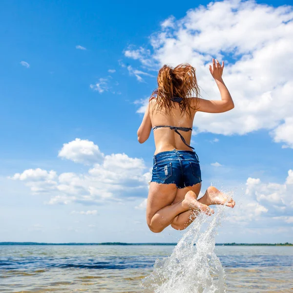 Beautiful young sexy model in the sea.