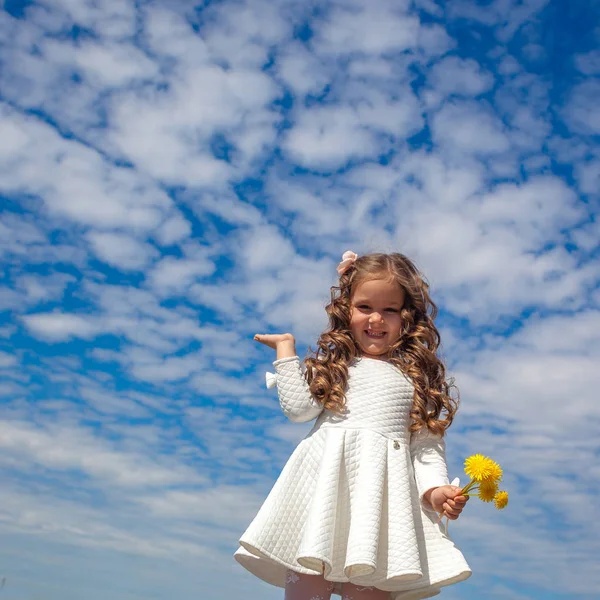 Little girl in the clouds — Stock Photo, Image