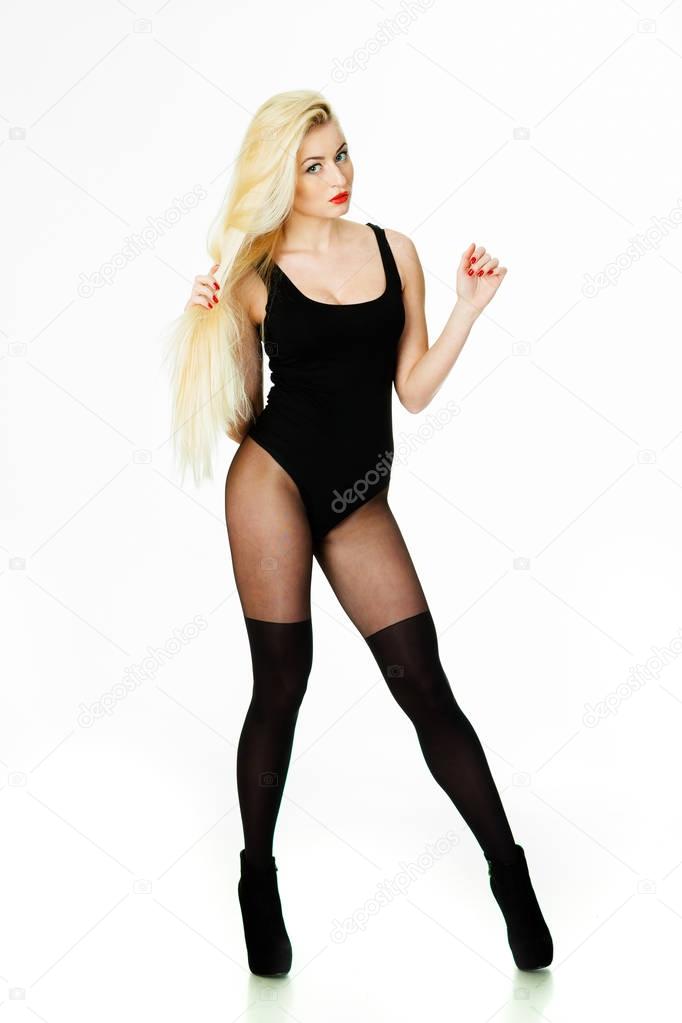 Erotic blonde girl in bodysuit on a white background