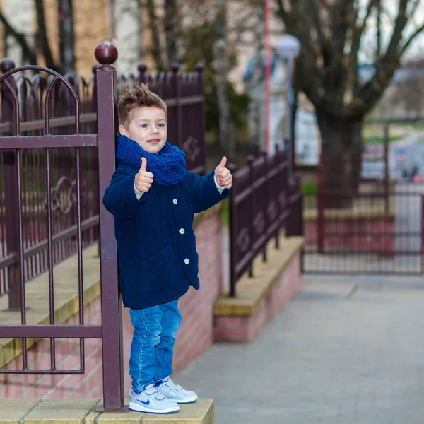 Trendy little boy. little boy shows big finger — Stock Photo, Image