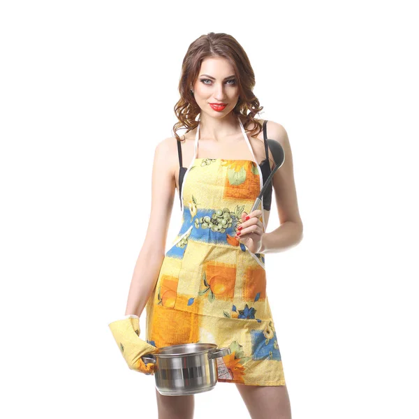 Housewife tries a soup. woman in an apron with a saucepan — Stock Photo, Image